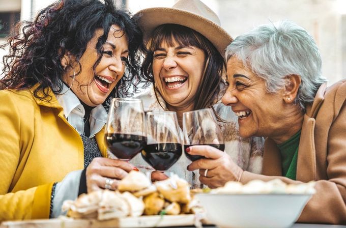 A group of women embracing positive aging by socializing.