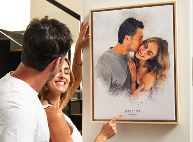 a man and woman looking at a picture of a man and woman