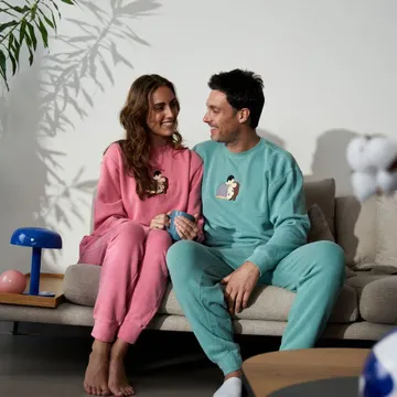 a man and a woman sitting on a couch