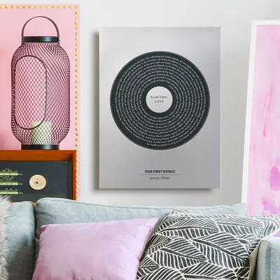 a living room with a couch and a painting on the wall