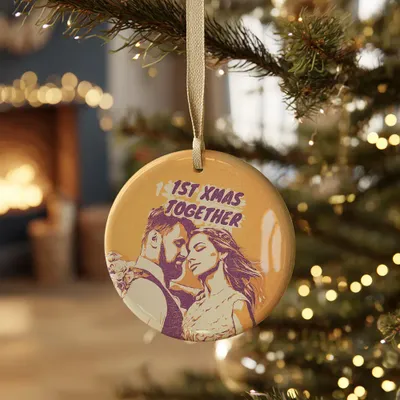 a ceramic ornament hanging from a christmas tree