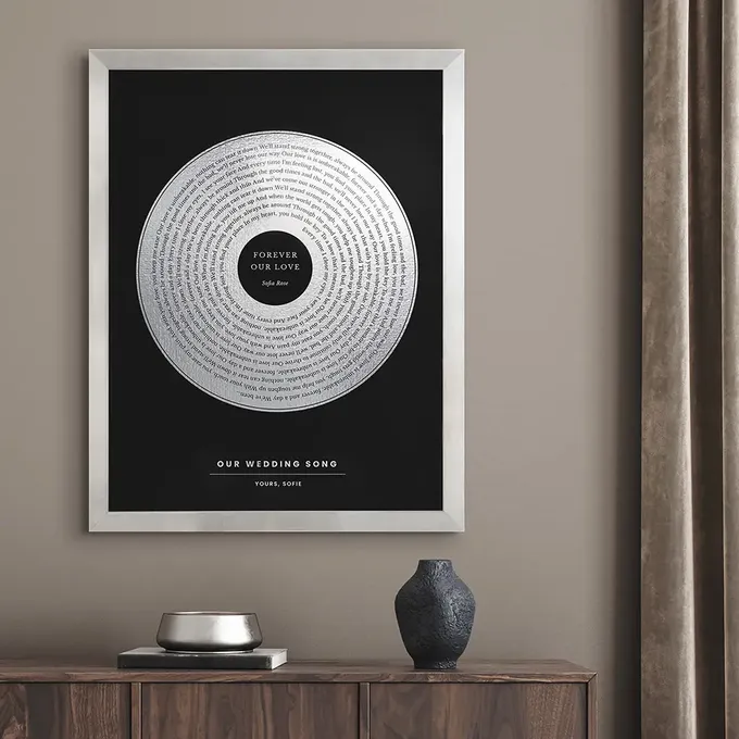 a black and white poster hanging on a wall