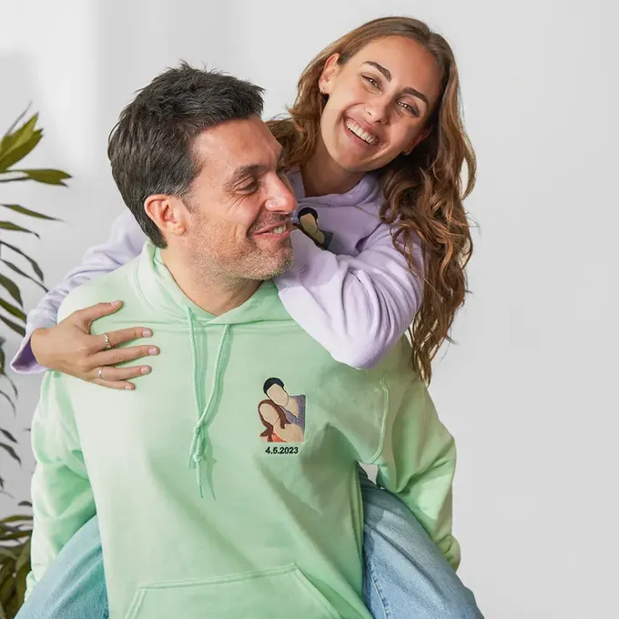 a man sitting on a woman's shoulders