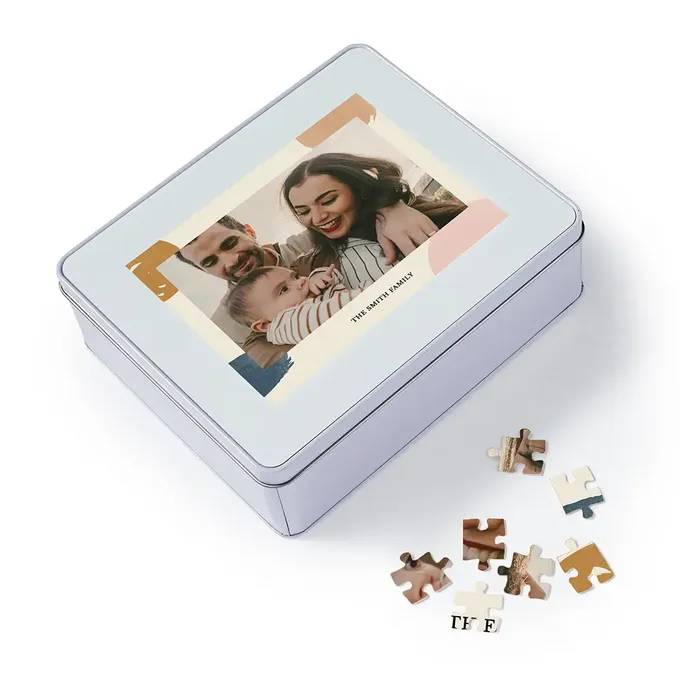 a puzzle box with a picture of a woman holding a baby