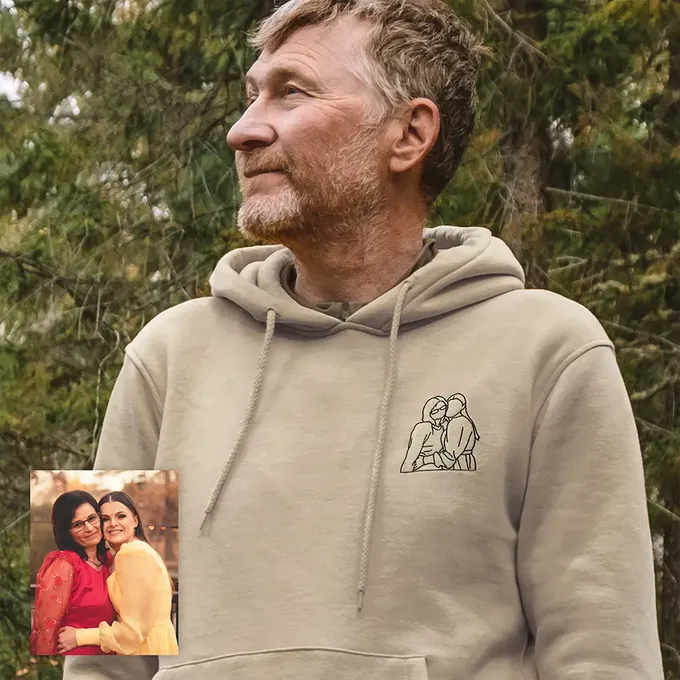 a man with a picture of a couple on his hoodie
