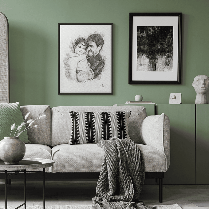 a living room with green walls and pictures on the wall