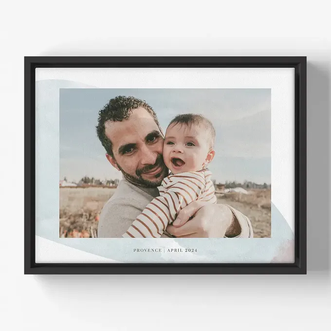 a man holding a baby in his arms