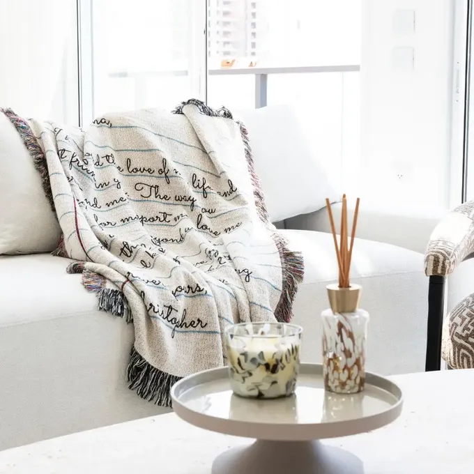 a living room filled with furniture and a white couch