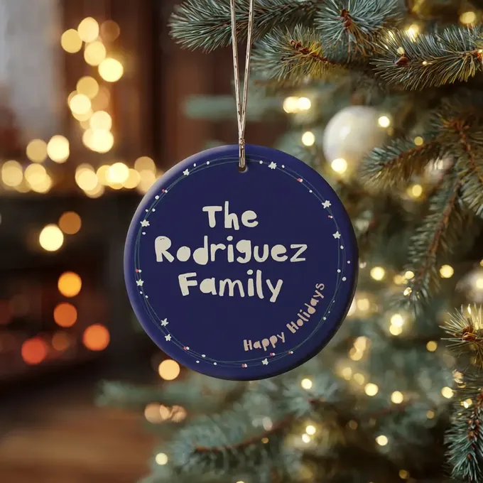 a blue ornament hanging from a christmas tree