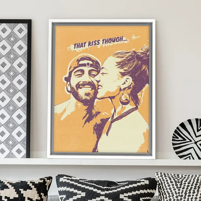 a picture of a man and a woman kissing on a couch