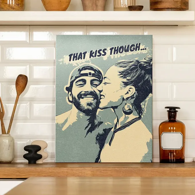 a picture of a man and a woman kissing on a kitchen counter