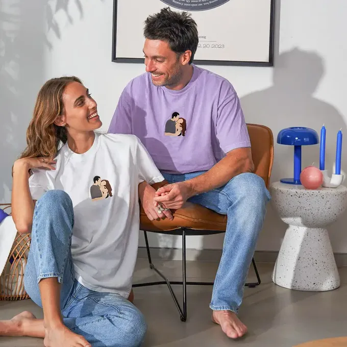 a man and a woman sitting on a chair