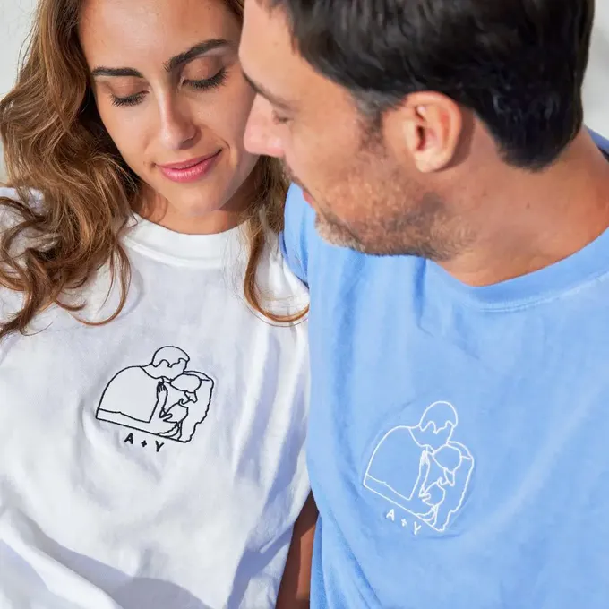 a man and a woman looking at a cell phone