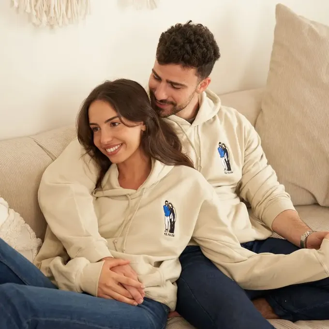 a man and a woman sitting on a couch