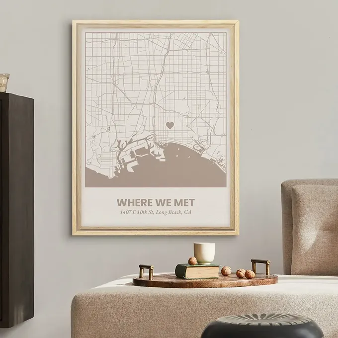 a living room with a couch and a map on the wall