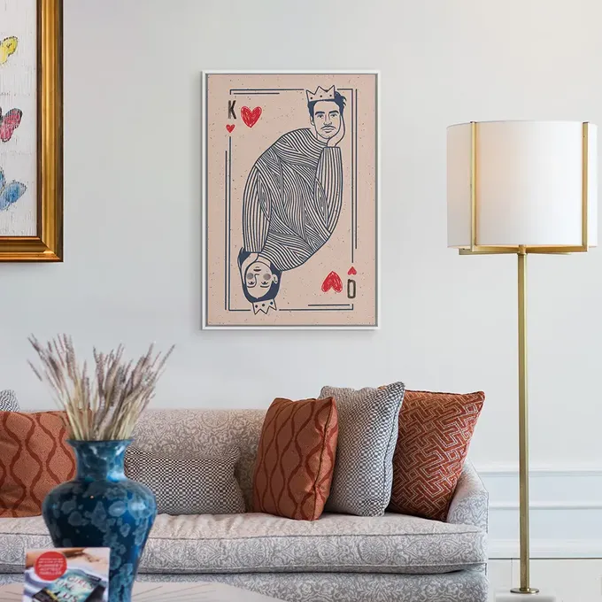 a living room filled with furniture and a painting on the wall