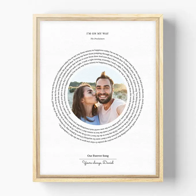 a wooden frame with a picture of a man and woman