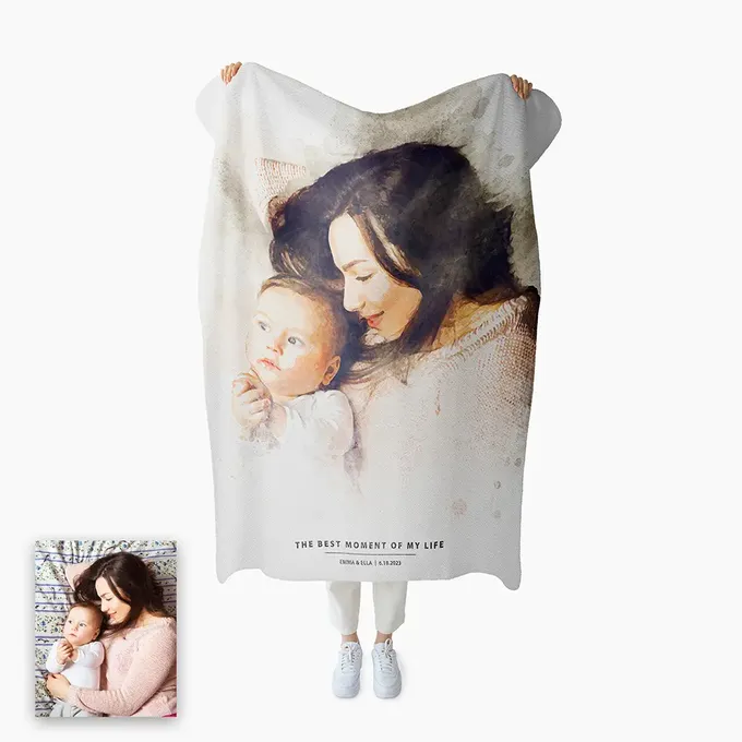 a blanket with a picture of a woman holding a baby