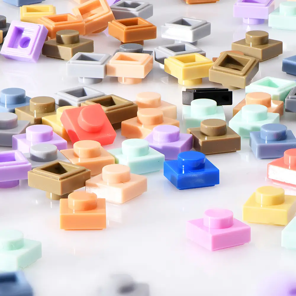 a pile of colorful brick art blocks sitting on top of a table