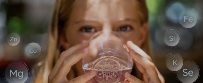 Girl drinking water infused with Mayu Water Minerals