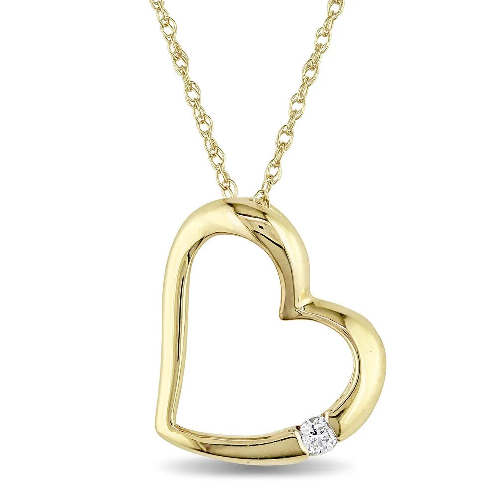 Stock image of a gold  hanging heart pendant with diamond  