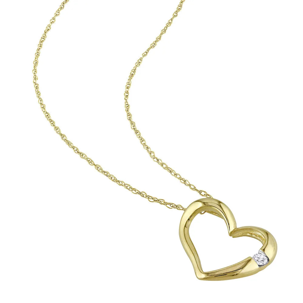 Stock image of a gold  hanging heart pendant necklace  with diamond