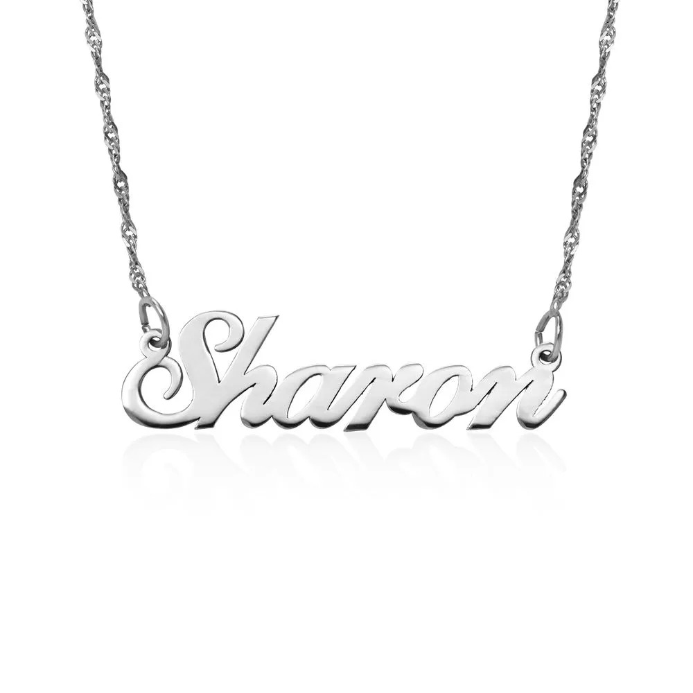 Stock Image of a white gold necklace with a name pendant 