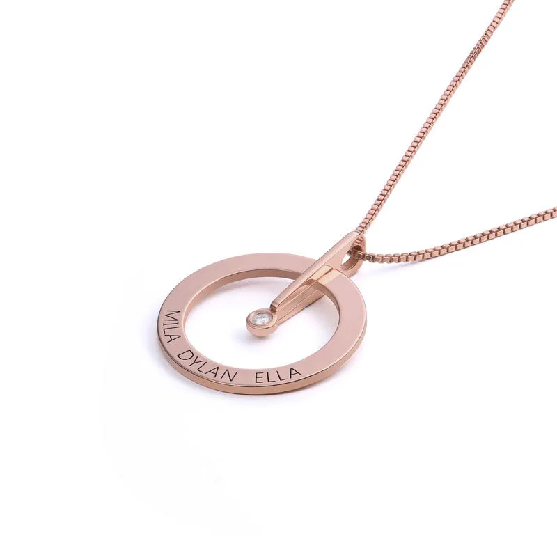 Stock image of a rose gold plated necklace with a circle pendant and diamond