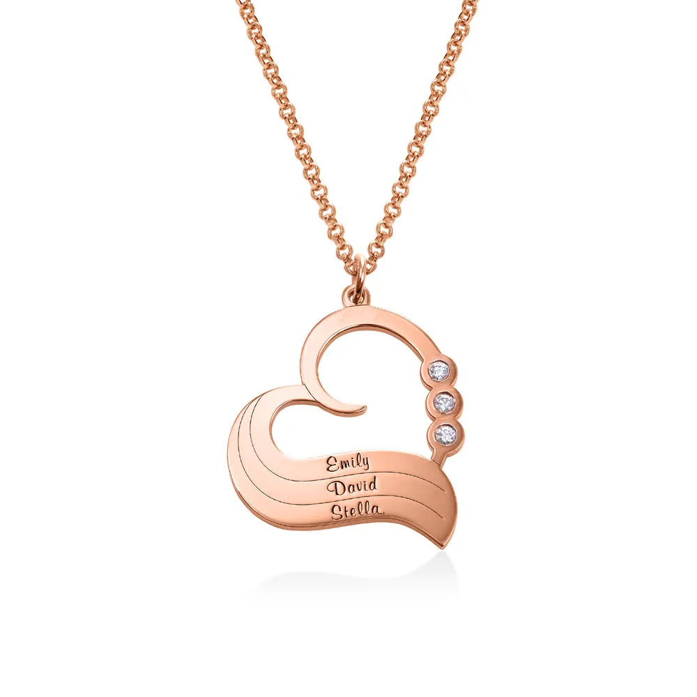 A rose gold plated necklace with a heart shaped pendant 