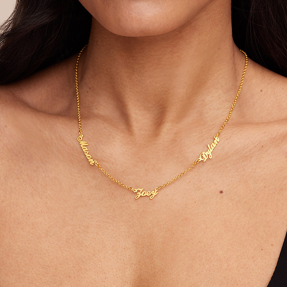 a close up of a woman wearing a gold necklace