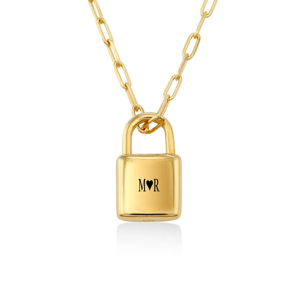 Stock image of a gold plated necklace with a padlock pendant 
