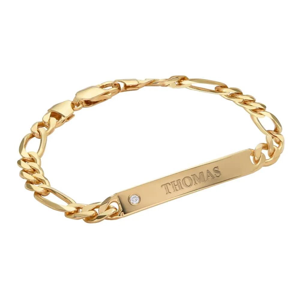 Stock Image of a gold vermeil ID bracelet with an inscription 