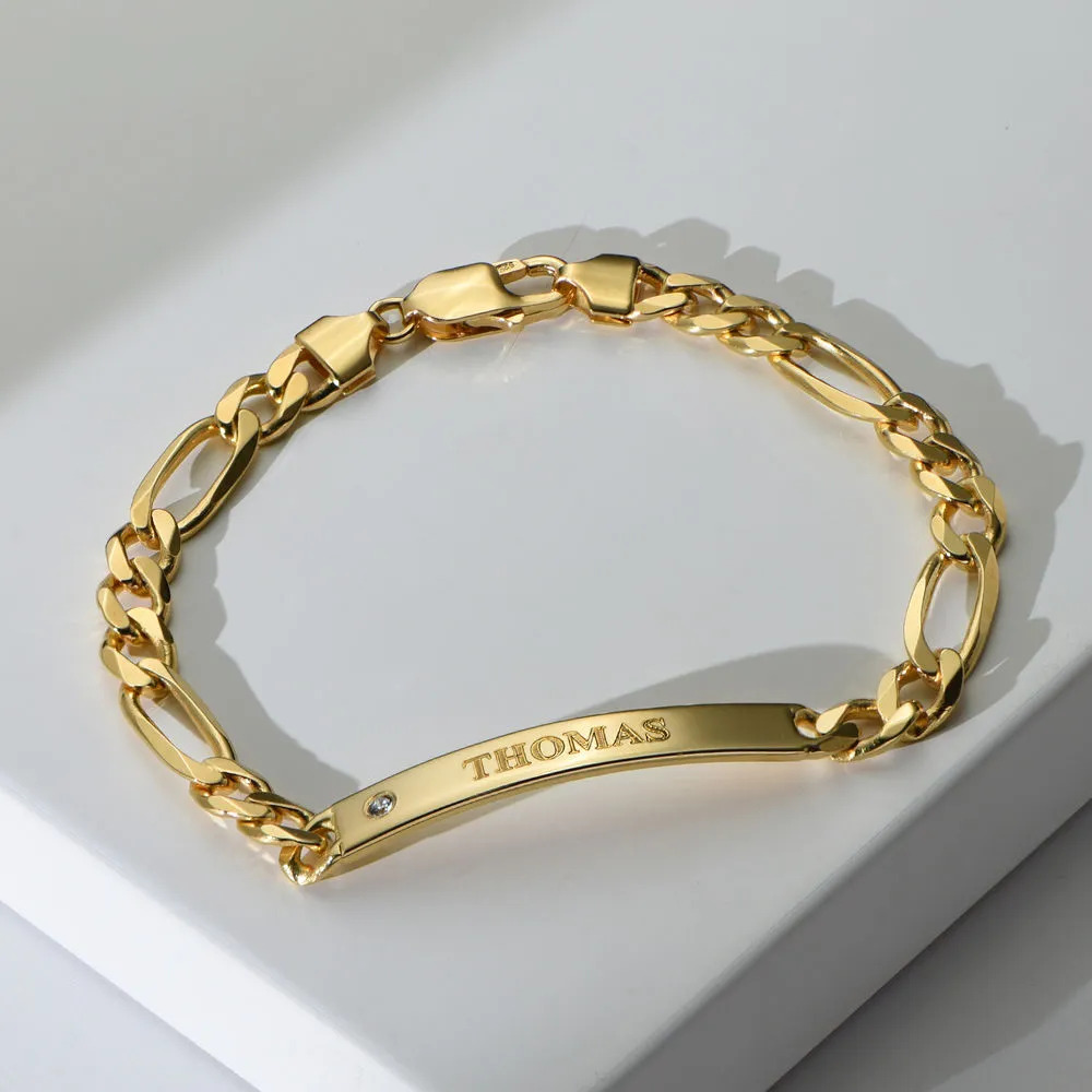 Stock image of a gold ID Bracelet with an inscription on a white block 