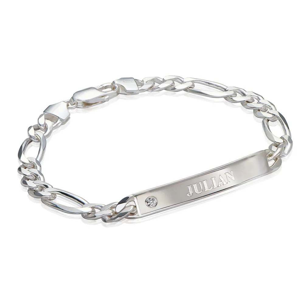 A sterling silver bracelet with an engraved pendant 