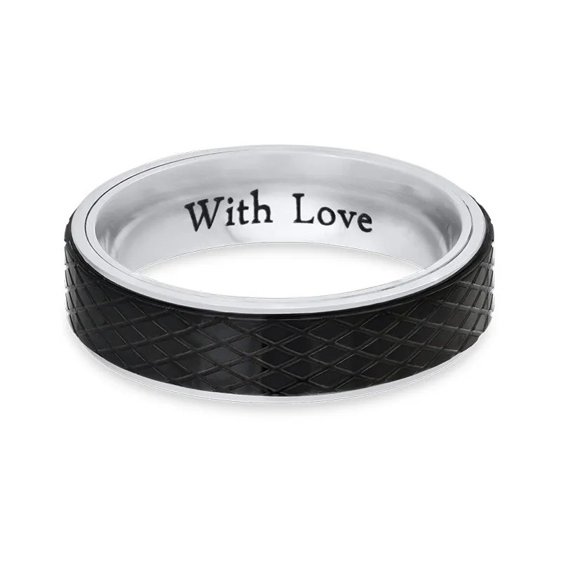 Stock image of a Black and silver stainless steel ring with an inscription 