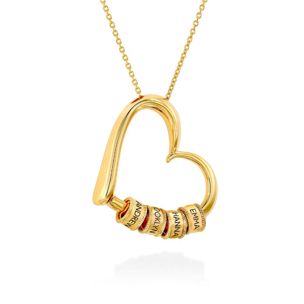 A Gold Plated Necklace with Engraved Beads on a heart shaped pendant