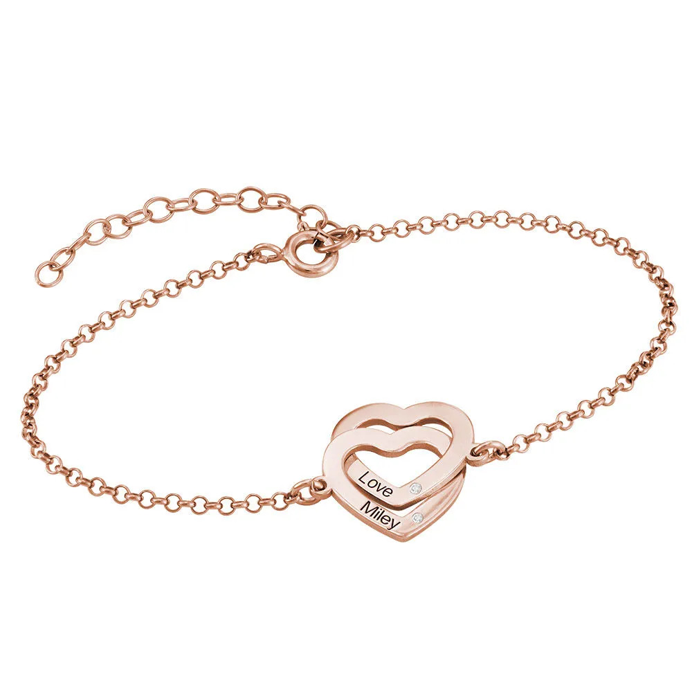 Stock image of a rose gold plated bracelet with interlocking  hearts