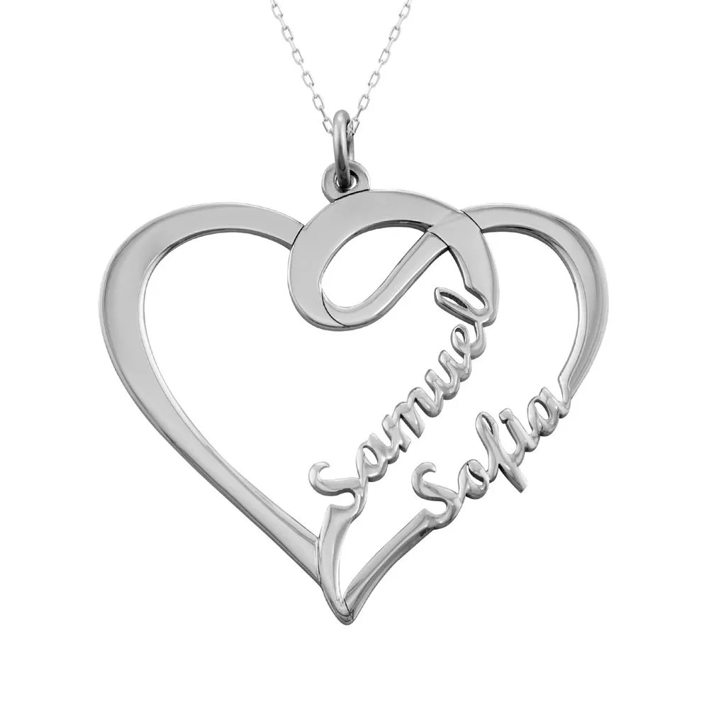 A heart shaped pendant in white gold with name inscriptions