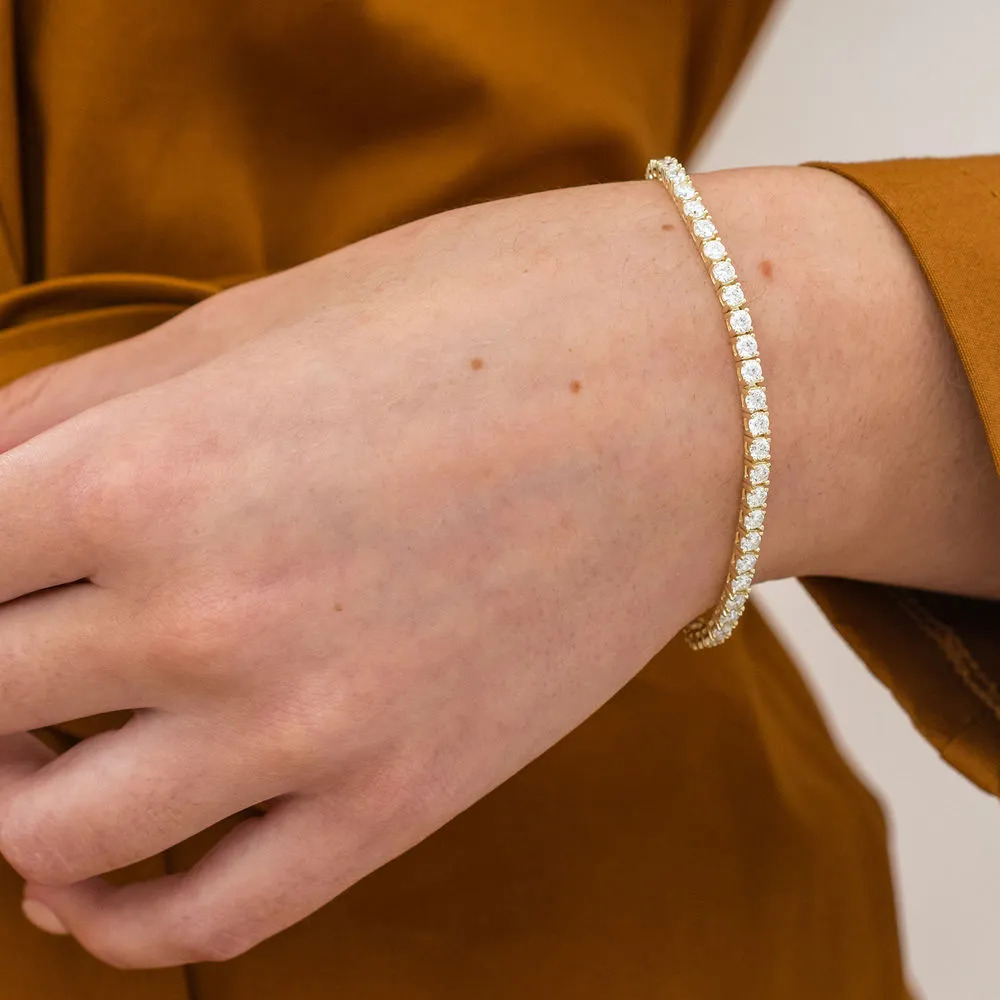 Woman wearing a  Created Moissanite Tennis Bracelet in Yellow Silver
