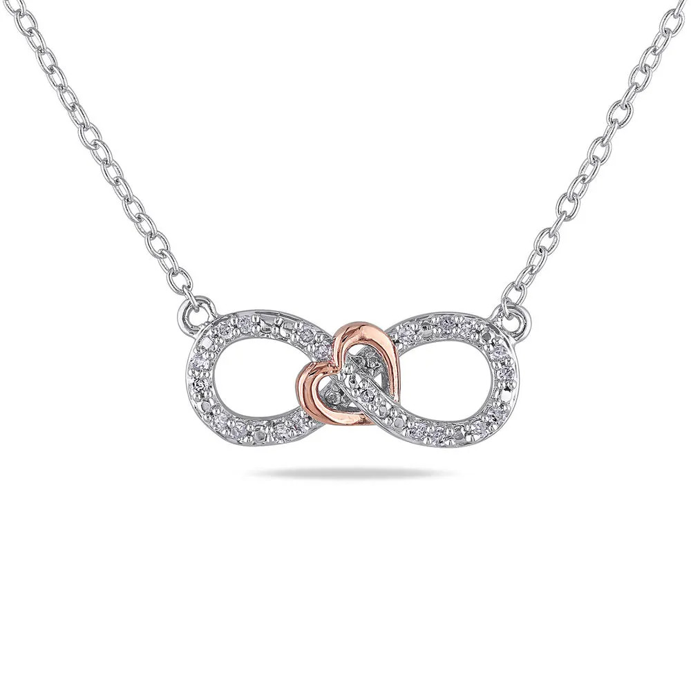 Stock image of a silver necklace with an interlocking diamond infinity pendant and rose gold heart