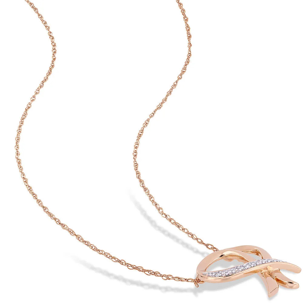 A rose gold necklace with a heart shaped pendant covered in diamonds 