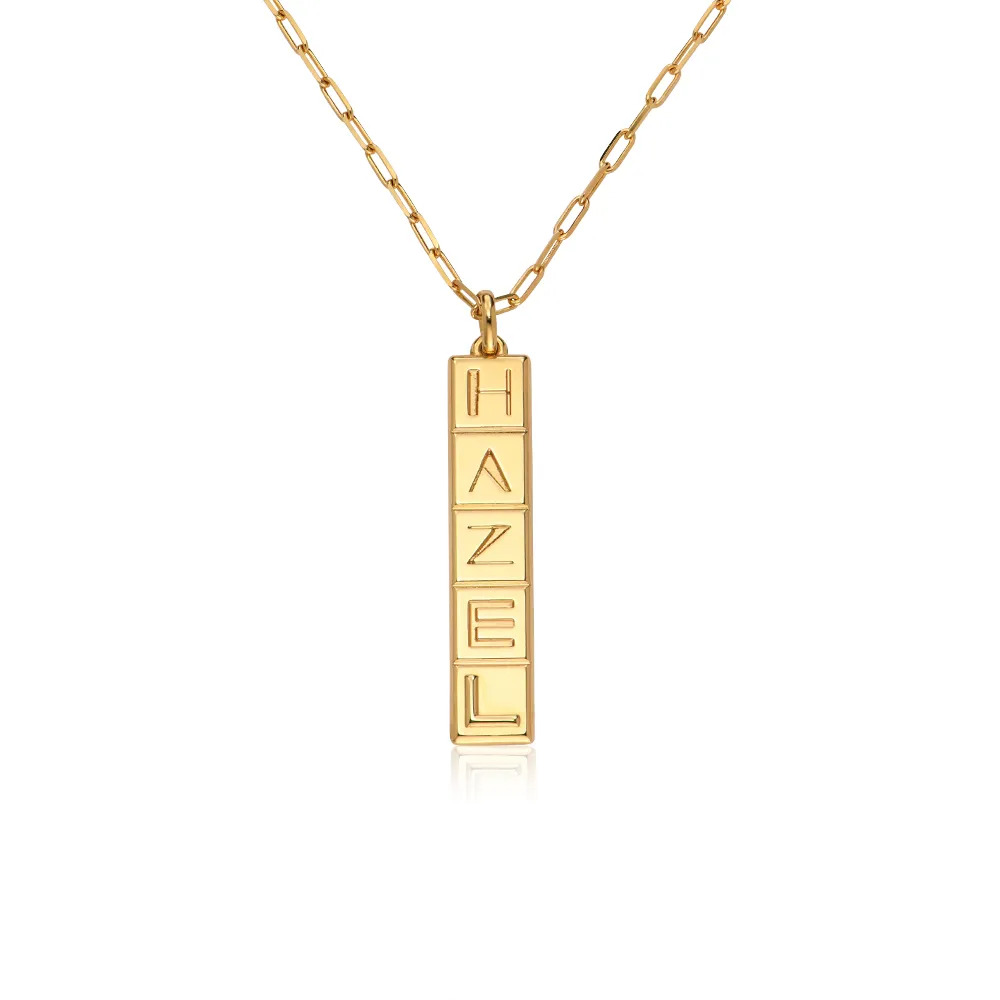 Stock image of a gold necklace with an inscribed  vertical tile pendant 
