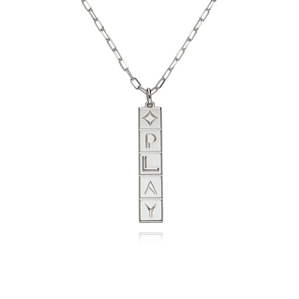 A sterling silver necklace with a domino style tile pendant 