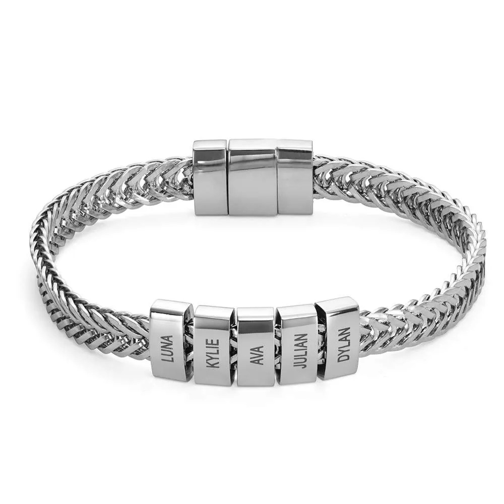 Stock image of a stainless steel bracelet with a locking clasp and  inscribed charms 