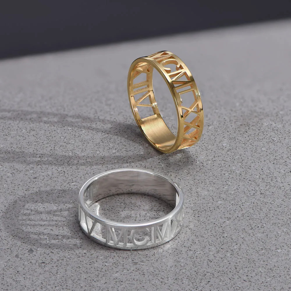 Stock image of  Sterling Silver and Gold plated rings on a  grey background 