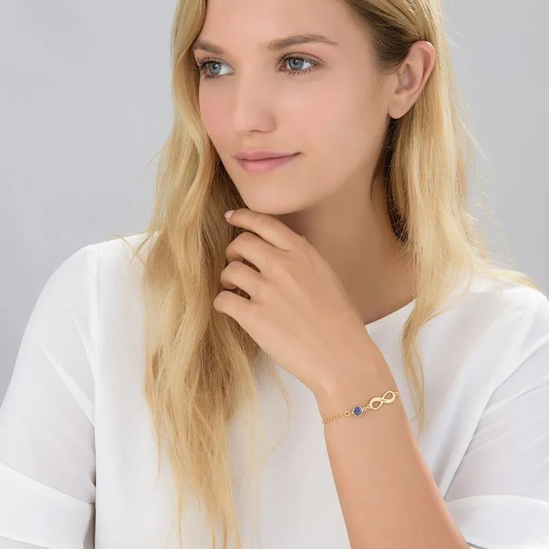 Woman wearing a  Gold Plated Infinity Birthstone Bracelet