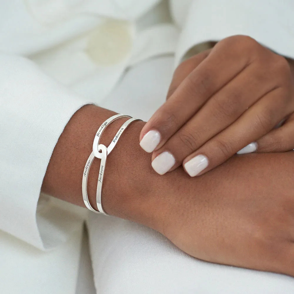 Woman wearing a custom silver bracelet cuff on her wrist 