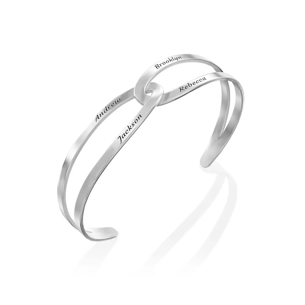 Stock Image of vertical view of the hand-in-hand bracelet cuff 