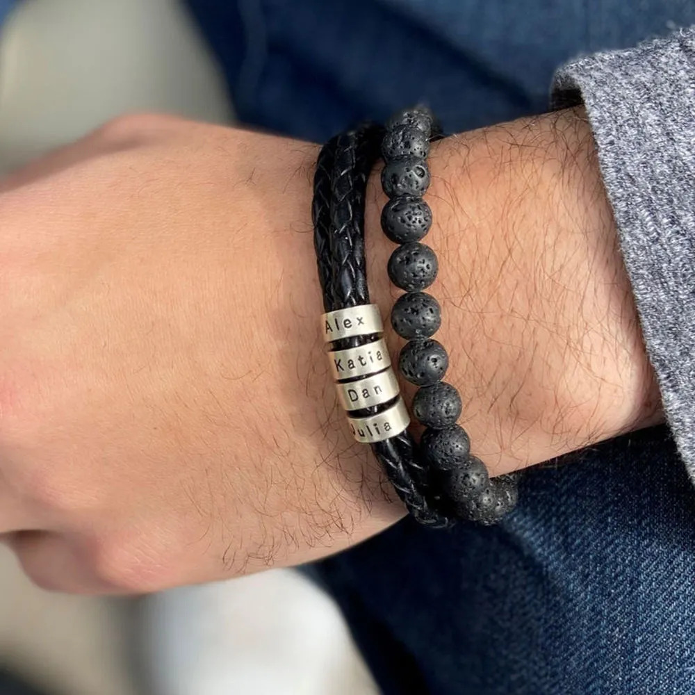 Man wearing a layered braided leather bracelet with a beads bracelet 