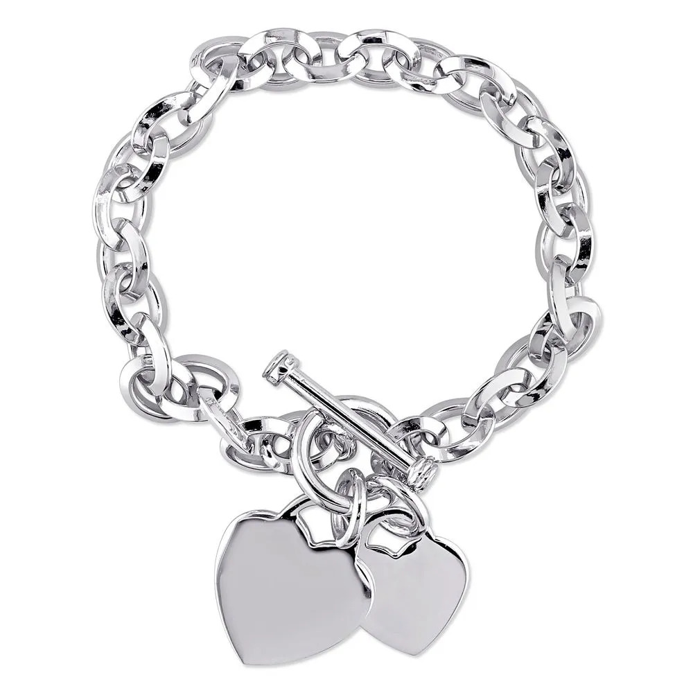 A sterling silver oval bracelet with a toggle clasp and heart charms 